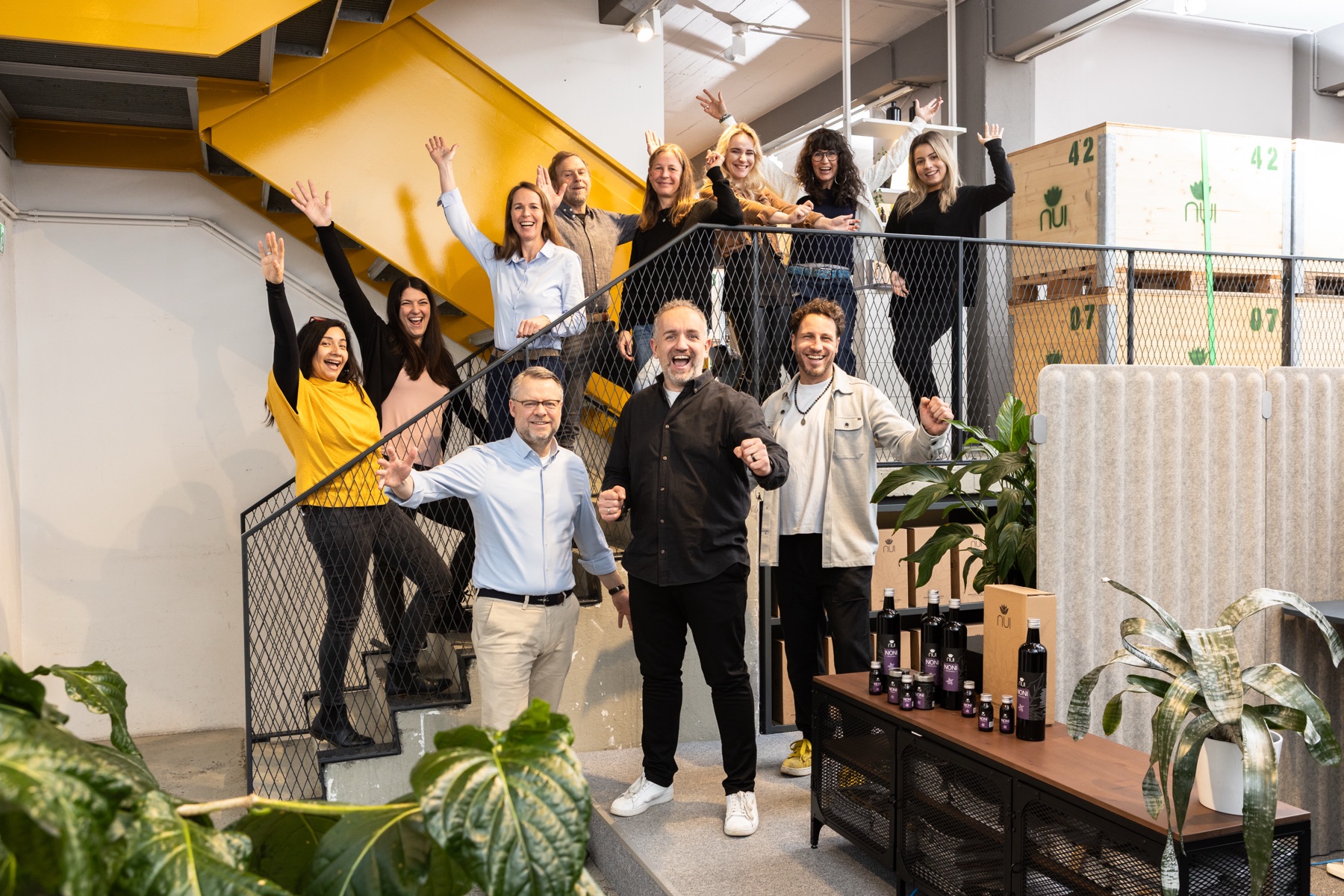The NUI team cheering in the stairwell at the Dornbirn site